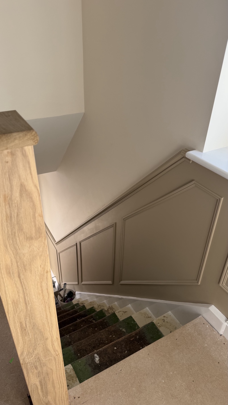 Decorative wall panelling following the angle of a staircase